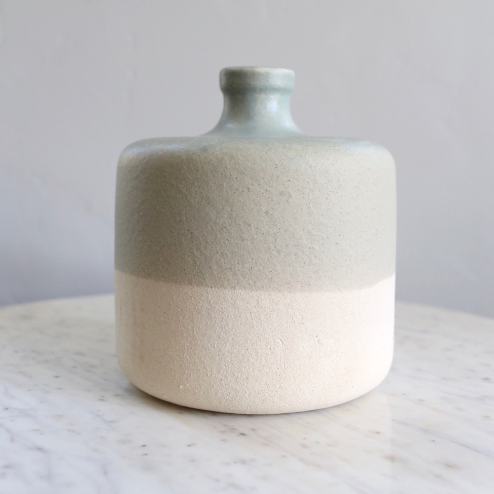 Green and ivory two toned pottery vase